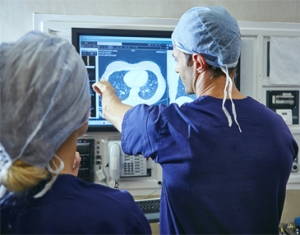 Doctors looking at a monitor
